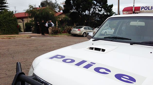 Police at the scene of the alleged murder earlier today. Photo: Tim Morris, 7News.