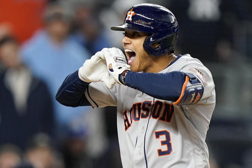 Houston Astros Jeremy Pena (3) reacts after hitting a three-run home run against the New York Yankees during the third inning of Game 4 of an American League Championship baseball series, Sunday, Oct. 23, 2022, in New York. (AP Photo/John Minchillo)