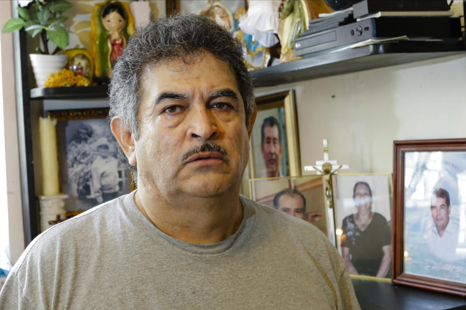 In this Thursday, June 4, 2020, photo, Francisco Flores poses for a portrait in New York. When his brother Crescencio Flores died of coronavirus in New York, his parents back in Mexico asked for one thing: that their son be sent home for burial. So far, his efforts have been in vain. “I am trying to do this because my parents, 85 and 87 years old, live there," Francisco Flores said. “They are rooted in their customs. They want a Christian burial for the remains of their son.” (AP Photo/Frank Franklin II)