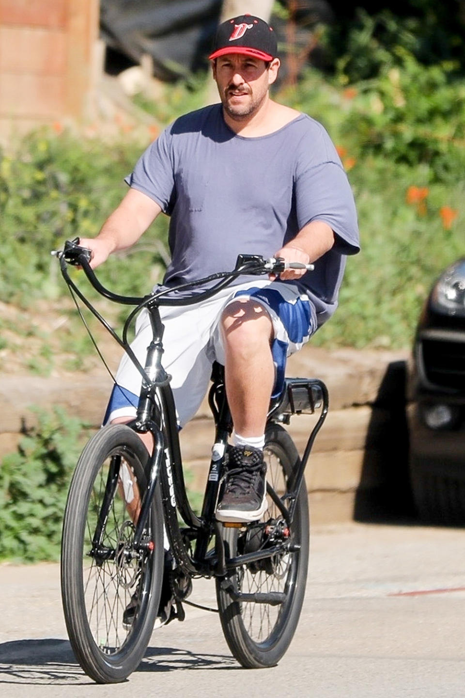 <p>Adam Sandler soaks up some sunshine while on a bike ride on Sunday in Malibu, California.</p>