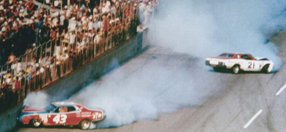 Wrecked cars of Richard Petty and David Person on the frontstretch at Daytona 500 in 1976.