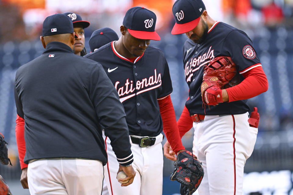 Washington Nationals starting pitcher Josiah Gray, center, leaves during the fifth inning of the team's baseball game against the Pittsburgh Pirates at Nationals Park, Thursday, April 4, 2024, in Washington. (AP Photo/John McDonnell)