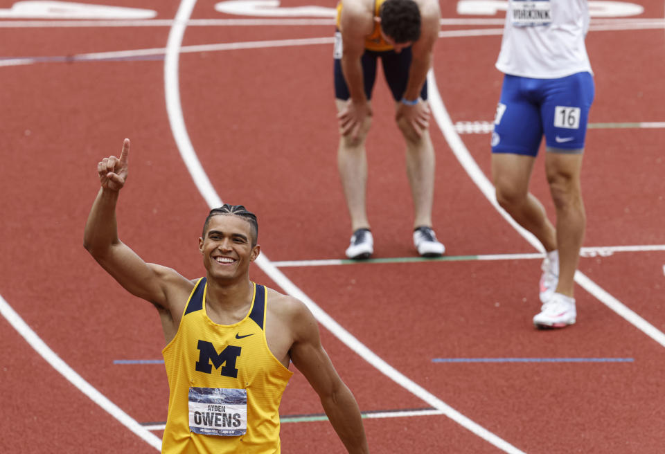 Michigan's Ayden Owens celebrates his win in the decathlon 1,500 meters to take second overall during the NCAA Division I Outdoor Track and Field Championships, Thursday, June 10, 2021, at Hayward Field in Eugene, Ore. (AP Photo/Thomas Boyd)