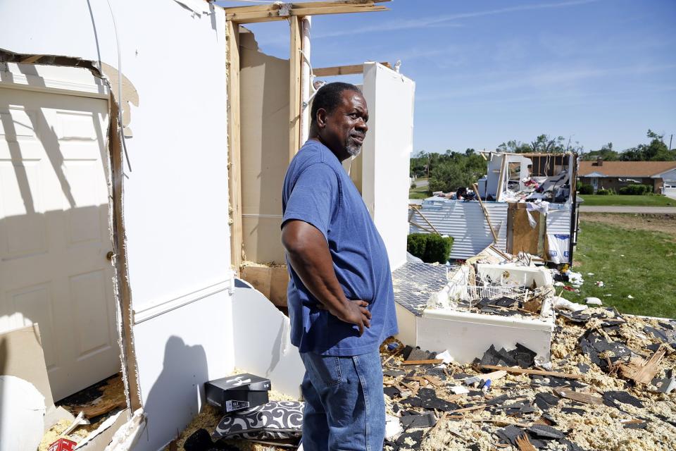 Trotwood resident George Garnes the roofless bedroom of his home on Denlinger Road after the tornado on Memorial Day.  Garnes said he was on a cruise with his wife when the tornado hit and they had to fly home early because his sister's home, next to his, had the entire roof come off as seen in the background here.  WHIO File