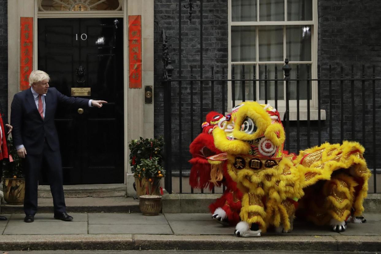 Boris Johnson greeted the Chinese Lions outside Downing Street on Friday: AP