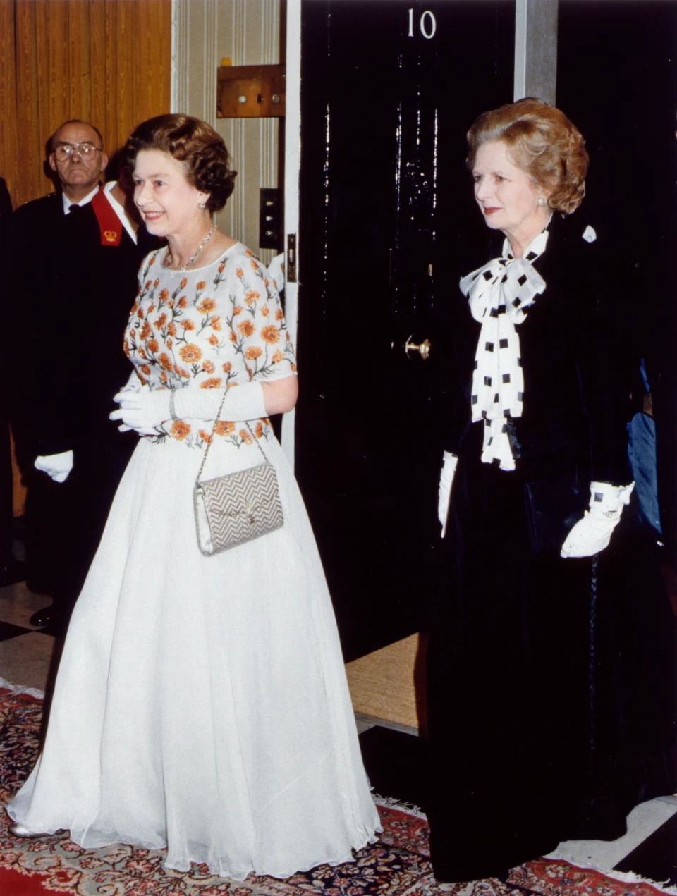 Her Majesty Queen Elizabeth II and Prime Minister Margaret Thatcher at Number 10 Downing Street wearing ball gowns December 1985. (Photo by Daily Mirror /Mirrorpix/Getty Images)