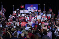 Republican gubernatorial candidate Glenn Youngkin, center, speaks during a rally in Glen Allen, Va., Saturday, Oct. 23, 2021. Youngkin will face Democrat Terry McAuliffe in the November election. (AP Photo/Steve Helber)