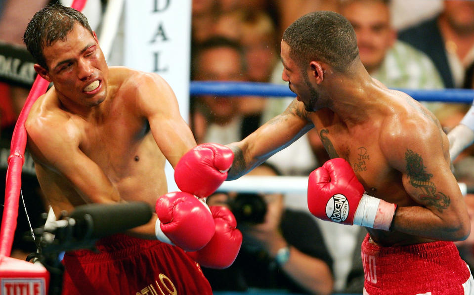 LAS VEGAS, NV - MAY 7: Diego Corrales lands a right on Jose Luis Castillo during their World Lightweight Unification bout on May 7, 2005 at The Mandalay Bay in Las Vegas, Nevada. Corrales won the fight after the referee stopped the fight in the tenth round. (Photo by Nick Laham/Getty Images). 