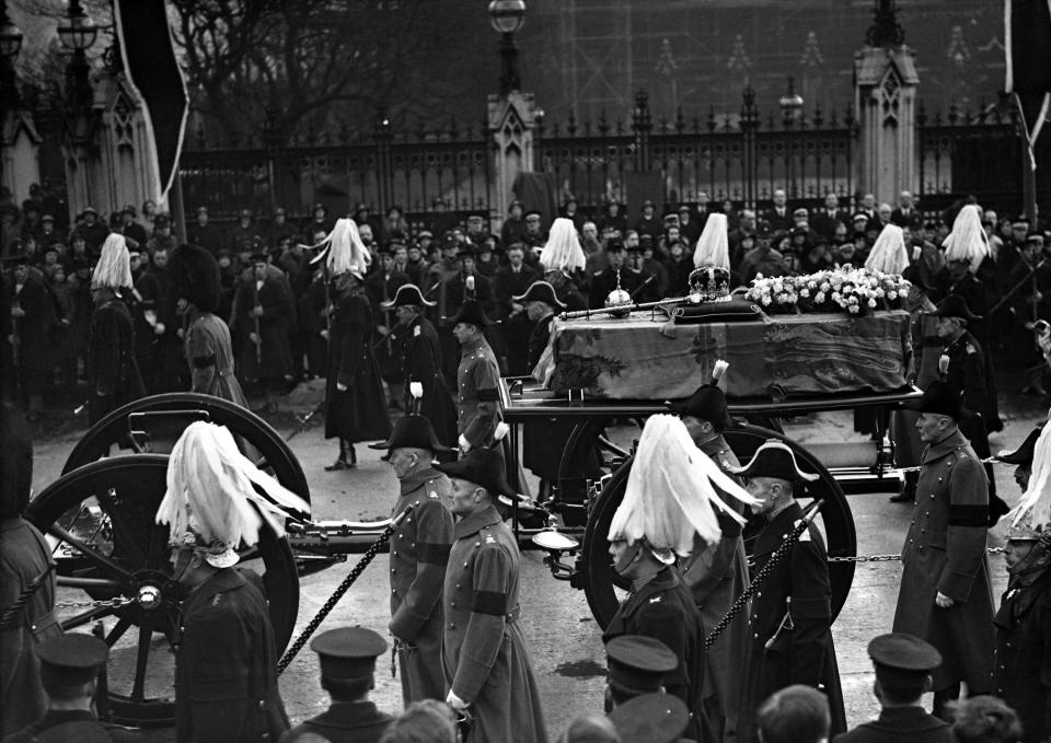 FILE - The gun carriage bearing the coffin of King George V, after leaving Westminster Hall in London on January 28, 1936. Hundreds of thousands of people are expected to flock to London’s medieval Westminster Hall from Wednesday, Sept. 14, 2022, to pay their respects to Queen Elizabeth II, whose coffin will lie in state for four days until her funeral on Monday. (AP Photo/Len Puttnam, File)