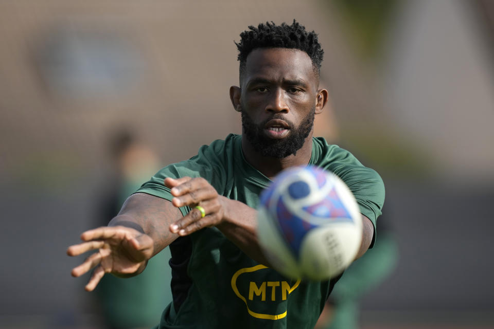 South Africa's Siya Kolisi passes the ball during a training session in Domont, near Paris, Tuesday, Oct. 17, 2023. South Africa will play against England during the Rugby World Cup semifinal match on Oct. 21. (AP Photo/Christophe Ena)