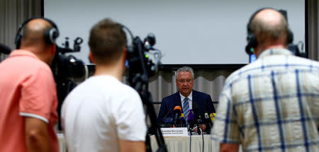 Bavarian Interior Minister Joachim Herrmann addresses a news conference after an explosion in Ansbach near Nuremberg, Germany, July 25, 2016. REUTERS/Michaela Rehle