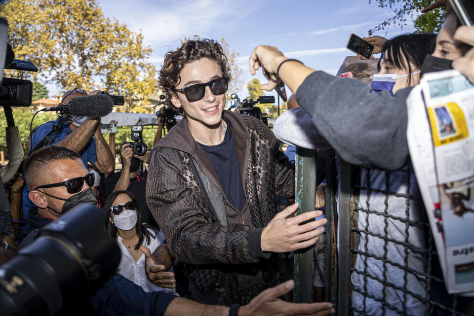 FILE - In this Sept, 3, 2021 file photo Timothee Chalamet meets fans upon arrival for the photo call of the film 'Dune' at the 78th edition of the Venice Film Festival in Venice, Italy. (AP Photo/Domenico Stinellis, File)