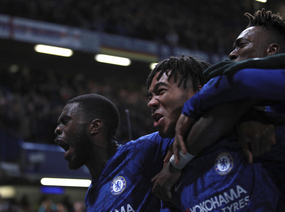 Chelsea's Reece James, center, celebrates with teammates after scoring his side's fourth goal during the Champions League, group H, soccer match between Chelsea and Ajax, at Stamford Bridge in London, Tuesday, Nov. 5, 2019. (AP Photo/Ian Walton)