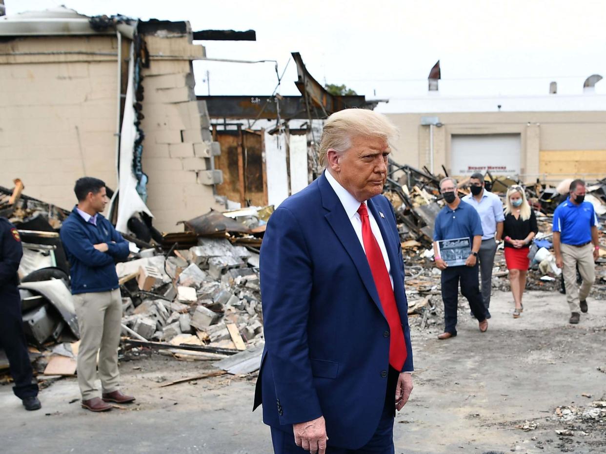 Donald Trump tours an area affected by civil unrest in Kenosha, Wisconsin, on 1 September 2020: Mandel Ngan/AFP/Getty