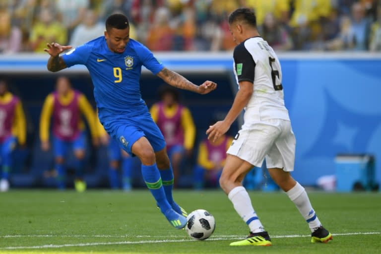 Back home in his favela, old friends and neighbors went wild when Brazil's forward Gabriel Jesus (L), shown marked by Costa Rica's defender Oscar Duarte during their World Cup Group E match, appeared to have scored