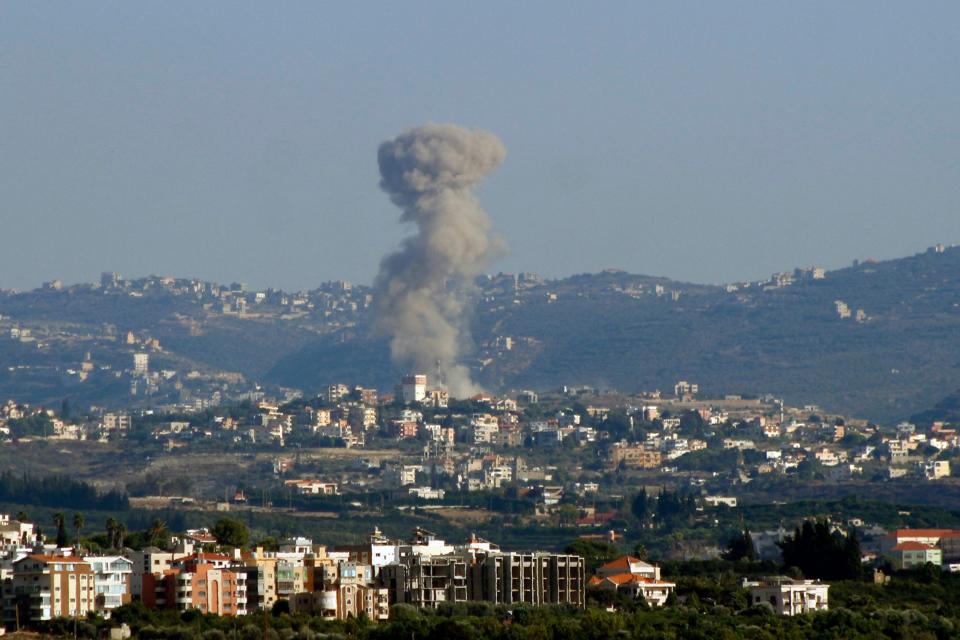 Smoke billows above the ancient city of Tyre, southern Lebanon, following an Israeli airstrike (AFP via Getty Images)