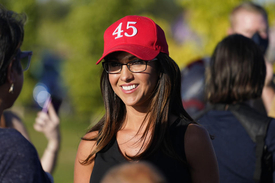 FILE - In this Sept. 4, 2020, file photo, Lauren Boebert, then-Republican candidate for the U.S. House of Representatives seat in Colorado's vast 3rd Congressional District, attends a freedom cruise staged by her supporters in Pueblo West, Colo. The district's newest representative, Boebert, is an unabashed, social media-savvy loyalist of former President Donald Trump who, like her fellow first-term colleague GOP Rep. Marjorie Taylor Greene of Georgia, is stoking controversy with her far-right views and defiant actions. But unlike Greene, Boebert doesn't hail from an overwhelmingly GOP, safe district. (AP Photo/David Zalubowski, File)