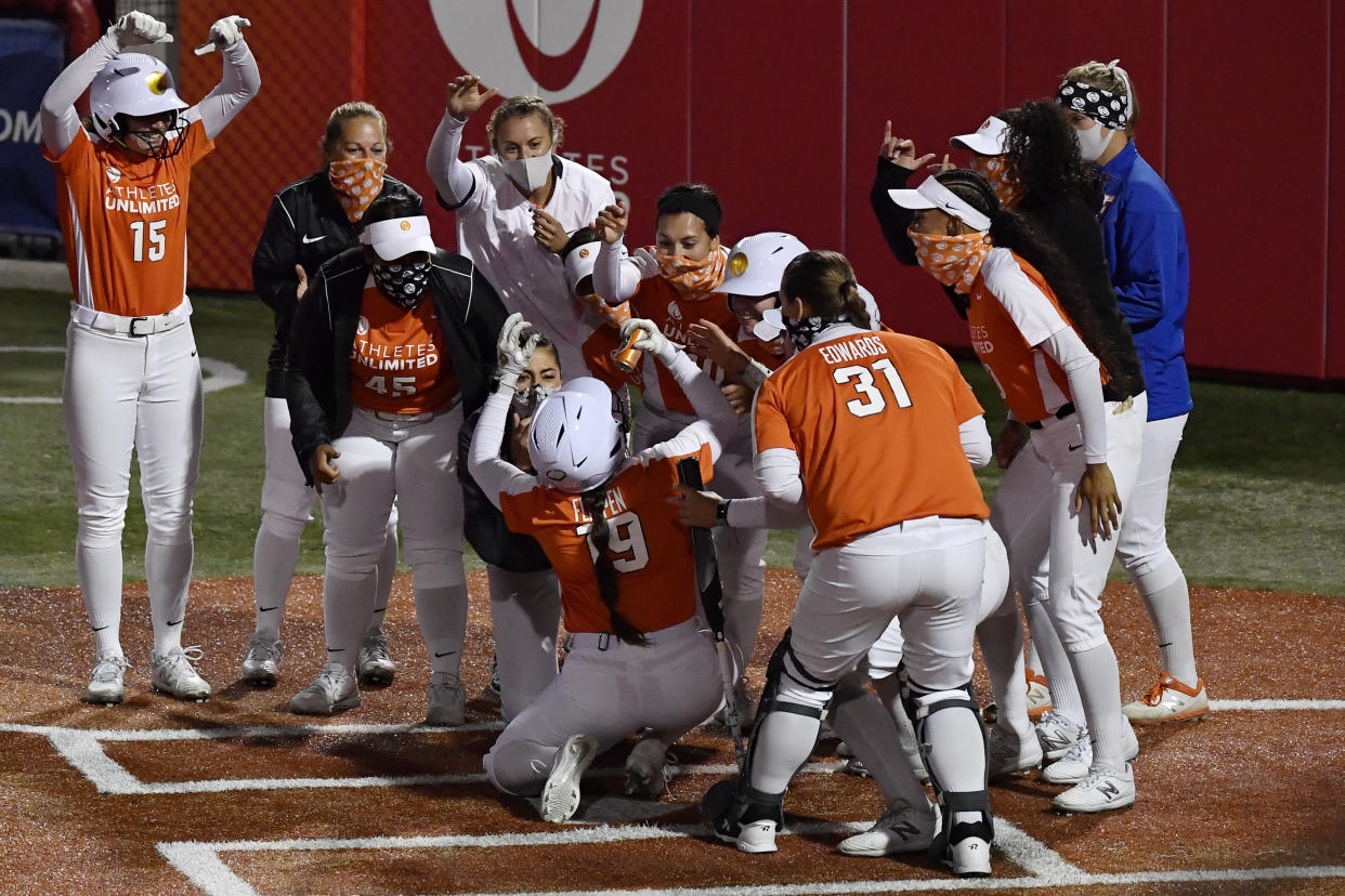 Hannah Flippen, No. 19 of Team Warren, celebrates with her teammates after her home run in the third inning against Team Osterman during the final weekend of the Athletes Unlimited softball league on Sept. 28, 2020, at Parkway Bank Sports Complex in Rosemont, Illinois. (Quinn Harris/Getty Images)