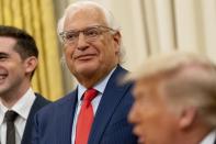 President Donald Trump, foreground, accompanied by U.S. Ambassador to Israel David Friedman, center, speaks in the Oval Office at the White House, Wednesday, Aug. 12, 2020, in Washington. Trump said on Thursday that the United Arab Emirates and Israel have agreed to establish full diplomatic ties as part of a deal to halt the annexation of occupied land sought by the Palestinians for their future state. (AP Photo/Andrew Harnik)