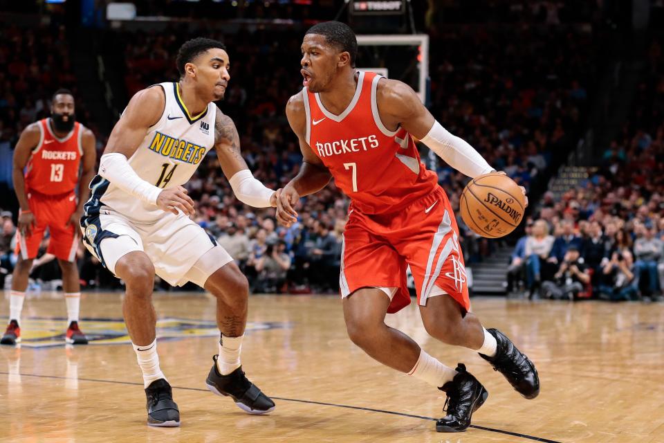 Feb 25, 2018; Denver, CO, USA; Denver Nuggets guard Gary Harris (14) guards Houston Rockets guard Joe Johnson (7) in the fourth quarter at the Pepsi Center. 