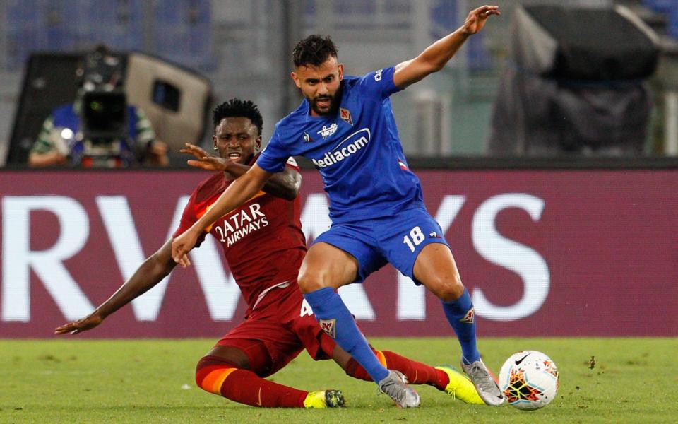 Amadou Diawara slide-tackles Fiorentina's Rachid Ghezzal - AP