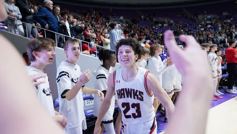 Alta’s Ace Reiser (23) prepares to celebrate with a teammate after winning the 5A boys basketball finals at the Dee Events Center at Weber State in Ogden on March 4, 2023.