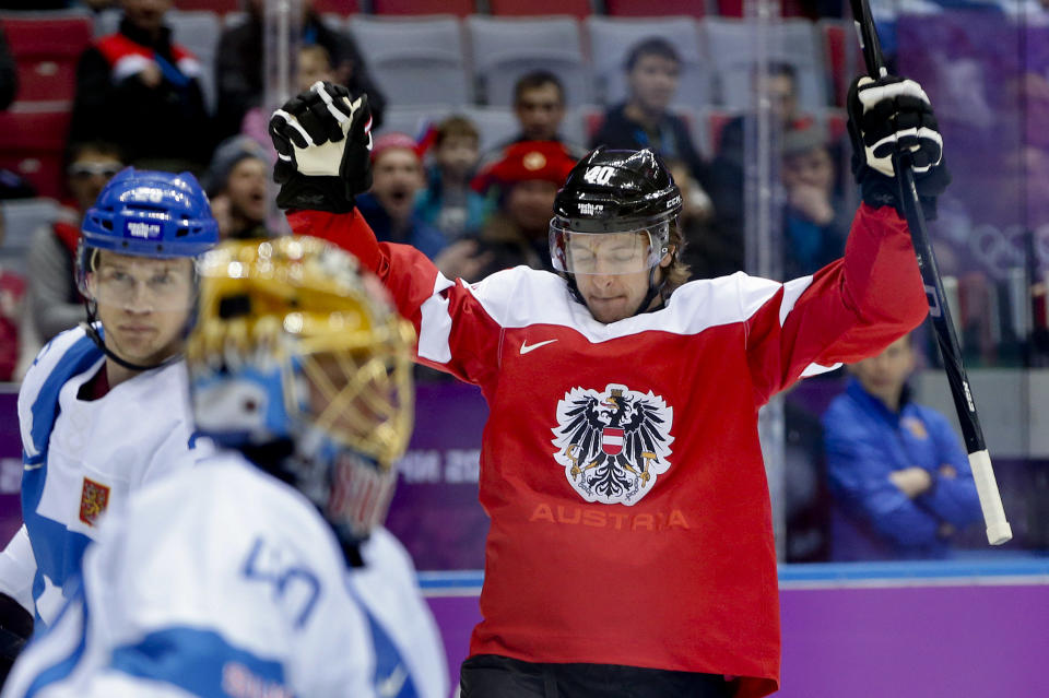 Austria forward Michael Rene Grabner reacts after scoring a goal against Finland in the first period of a men's ice hockey game at the 2014 Winter Olympics, Thursday, Feb. 13, 2014, in Sochi, Russia. (AP Photo/Julio Cortez)