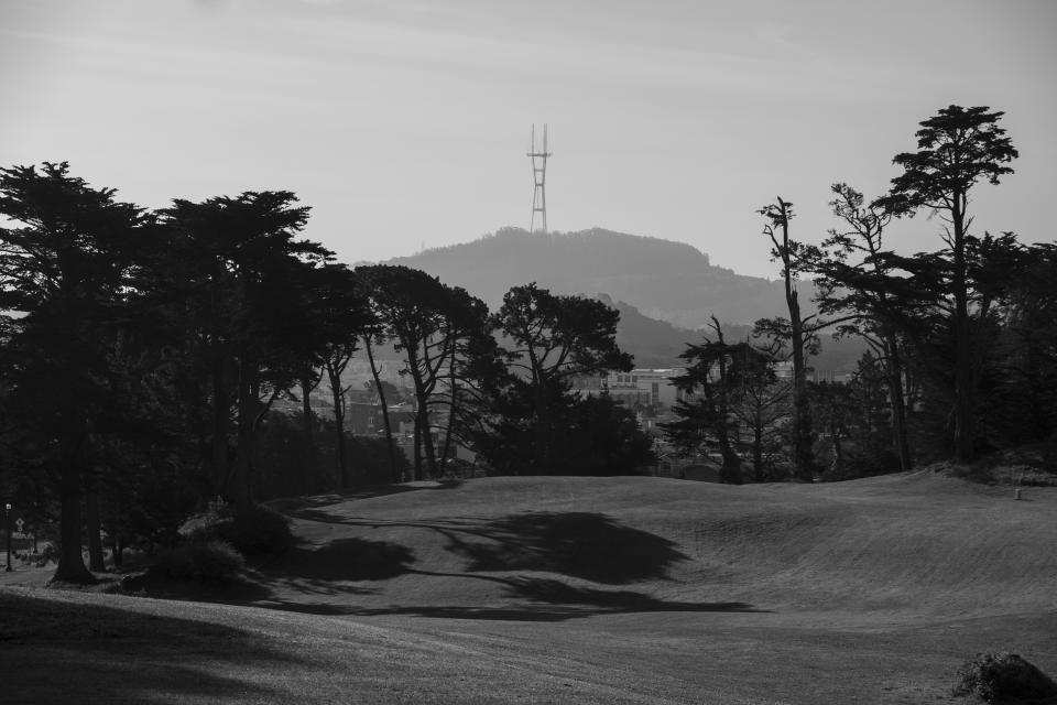 Shadows from cypress trees fall on the empty Lincoln Park Golf Course with Sutro Tower in the background in San Francisco on May 1, 2020. Normally, the months leading into summer bring bustling crowds to the city's famous landmarks, but this year, because of the coronavirus threat they sit empty and quiet. Some parts are like eerie ghost towns or stark scenes from a science fiction movie. (AP Photo/Eric Risberg)