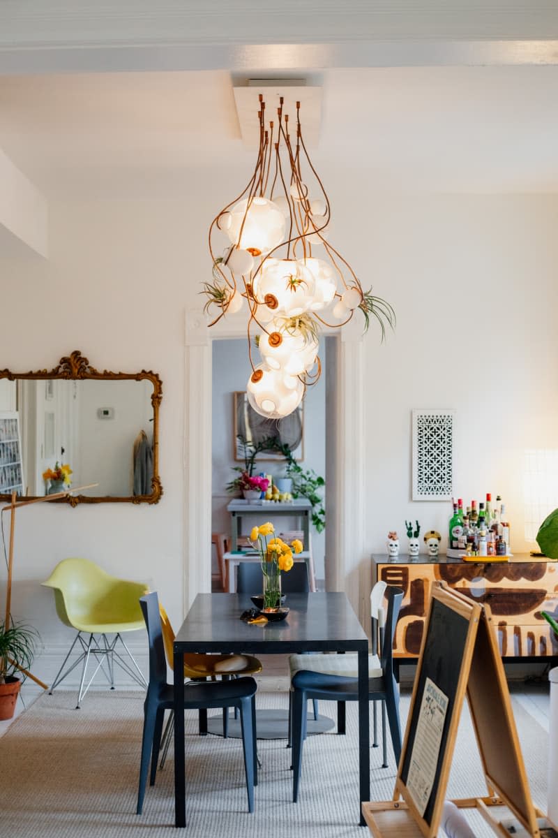Light fixture hung above dining room table.