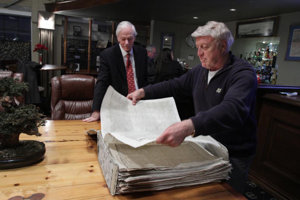 A 2012 Journal file photo shows Providence City Archivist Paul R. Campbell, left, and historian Patrick T. Conley as they read some of the articles and advertisements in the 184 Revolutionary War-era Providence newspapers (Manufacturers and Farmers Journal and Providence and Pawtucket Advertiser) Conley donated to the city archives.