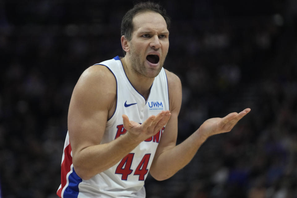 Detroit Pistons forward Bojan Bogdanovic (44) reacts to a foul during the first half of an NBA basketball game against the Utah Jazz Wednesday, Jan. 3, 2024, in Salt Lake City. (AP Photo/Rick Bowmer)