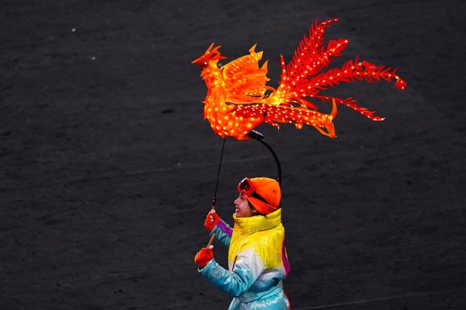 A dancer performs during the pre-show ahead of the opening ceremony of the 2022 Winter Olympics, Friday, Feb. 4, 2022, in Beijing. (AP Photo/Matt Slocum)