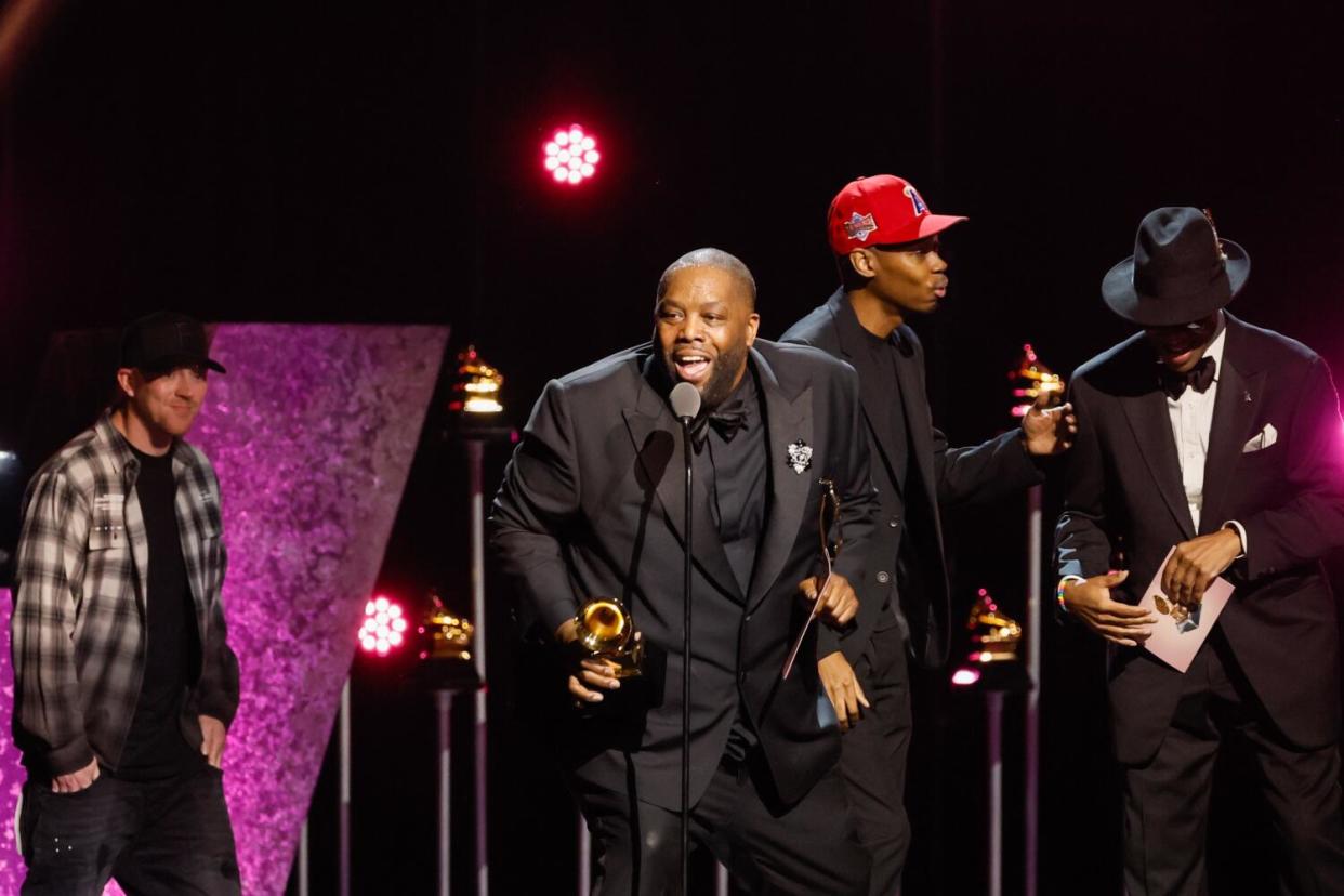 Killer Mike accepts the award for Rap Album at the 66th Grammy Awards Premiere Ceremony