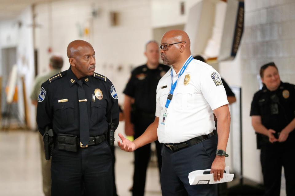 Savannah Chatham County Public Schools Campus Police Chief Terry Enoch talks with Savannah Police Chief Roy Minter during an active shooter drill.
