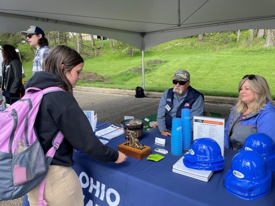 Newark sophomore Kyra Jurden talks with Charlie Dixon and Shawn Toy from the Ohio Natural Energy Institute about future opportunities, during a skilled trades celebration.