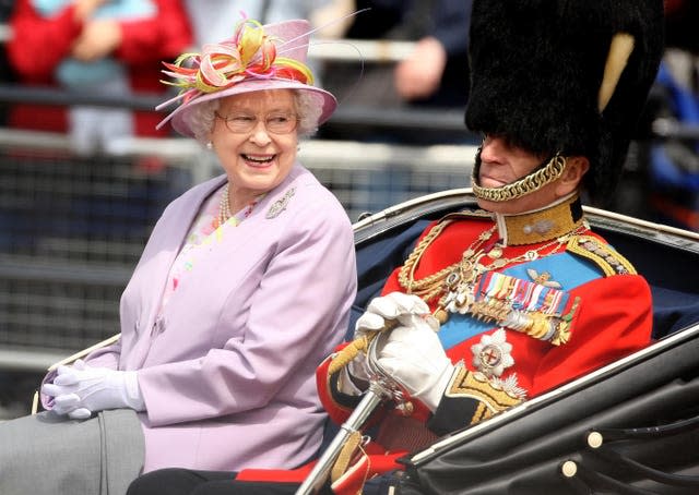 The Queen and the Duke of Edinburgh return to Buckingham Palace by carriage following the Trooping the Colour ceremony at Horse Guards Parade