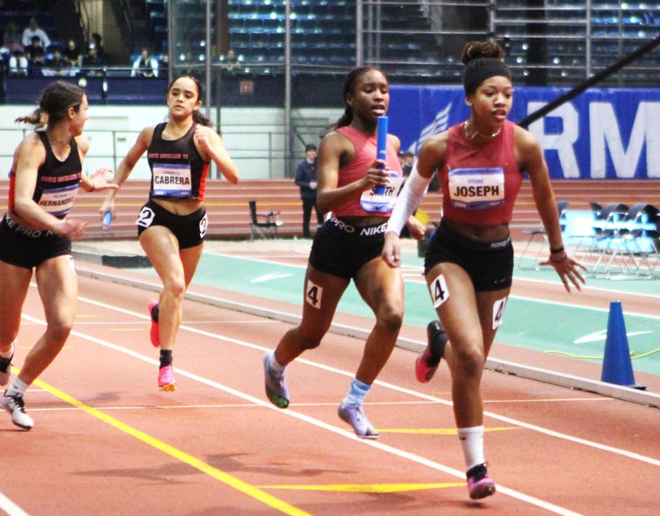 North Rockland's Gabriella Cabera, at left, prepares to hand the baton to Desirae Hernandez as, at right, New Rochelle's Ryann Joseph takes the baton from Alivia Smith during the Nike Indoor Nationals girls 4x200 relay March 9, 2024 at The Armory.