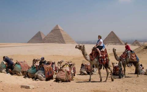 Camel rides are often sold to tourists at the Giza site