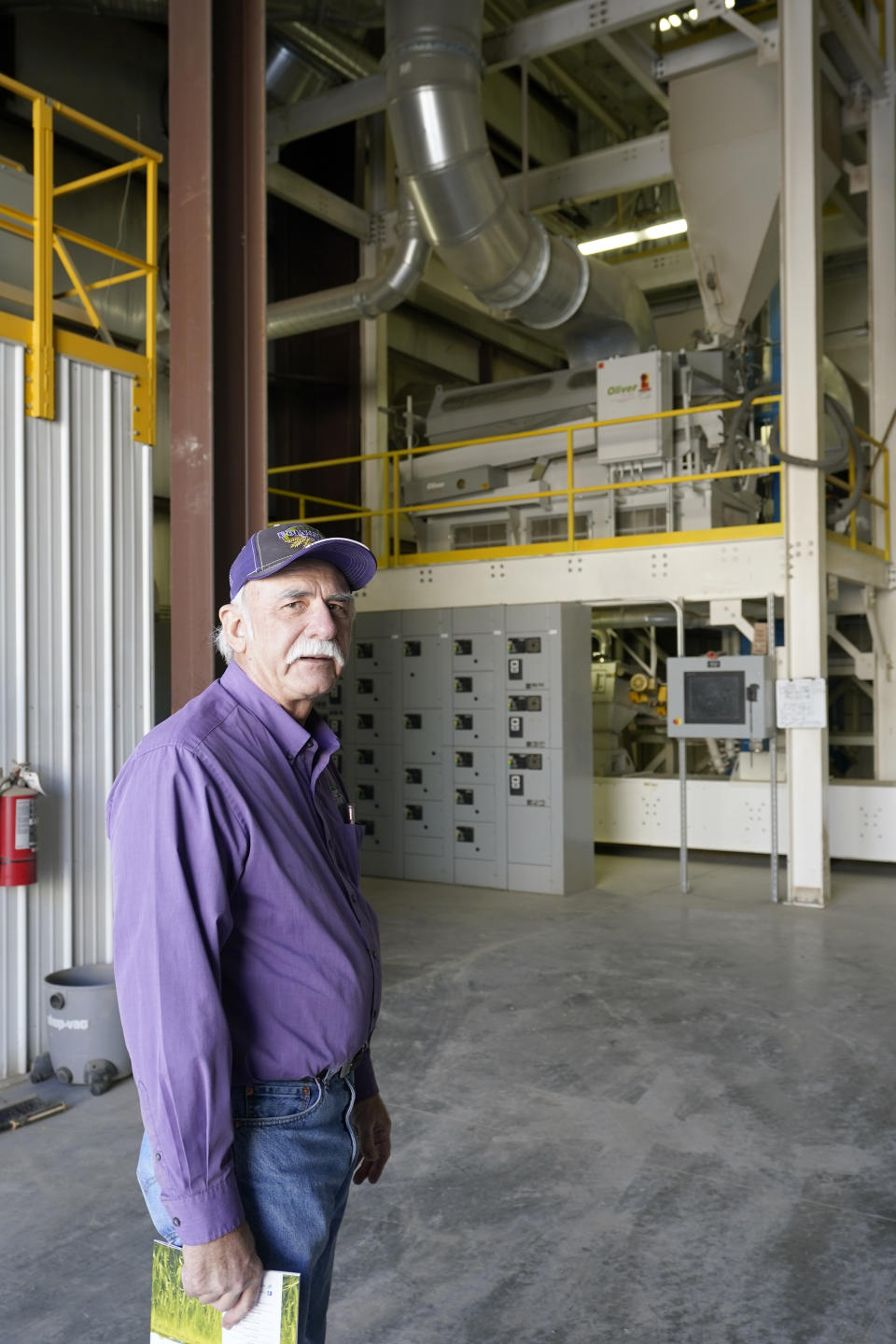 Adrian Polansky, a farmer and former executive director of the USDA’s Farm Service Agency office in Kansas during the Obama administration, stops for a photo while touring his seed processing plant near Belleville, Kan., Friday, March 5, 2021. More than a year after two U.S. Department of Agriculture research agencies were moved from the nation’s capital to Kansas City, they remain critically understaffed and some farmers are less confident in the work they produce. (AP Photo/Orlin Wagner)