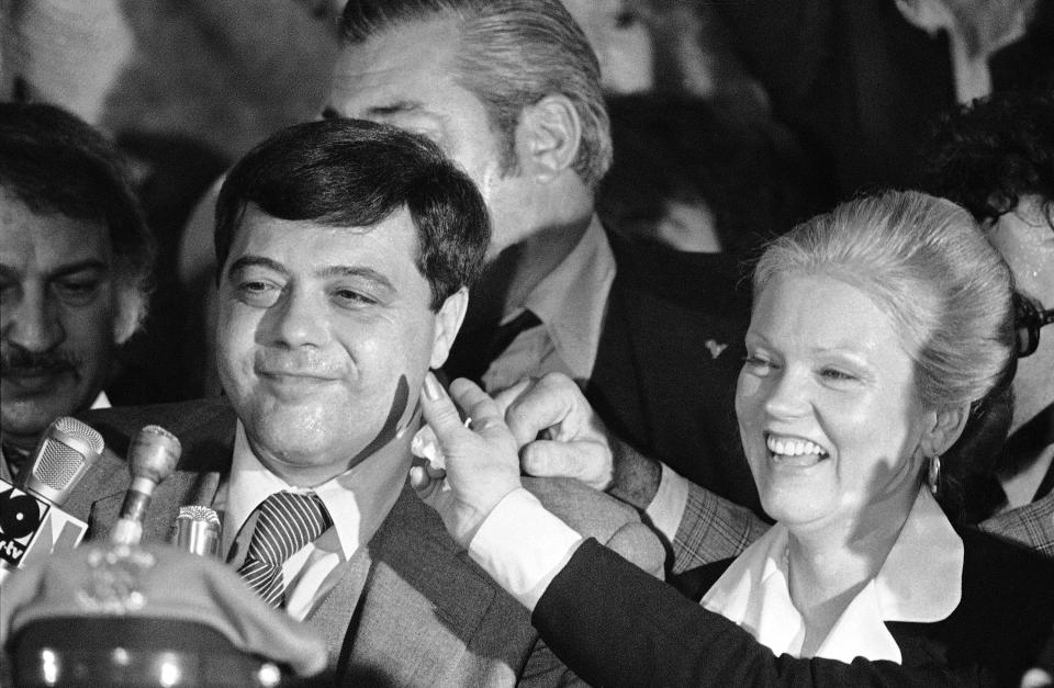 FILE - In this Nov. 8, 1978 file photo, Vincent A. "Buddy" Cianci Jr. gives a winning smile beside his wife Shelia, right, while a supporter reaches out to touch the re-elected mayor during a victory party in a Providence, R.I. "The Prince of Providence," a new stage play opens Sept. 12, 2019, about the late mayor, who died at age 74 on Jan. 28, 2016, in Providence. (AP Photo/Paul Benoit, File)