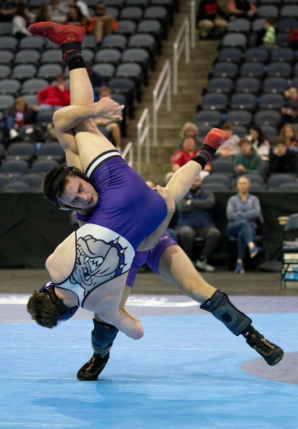 Bloomington South’s Evan Roudebush and Brownsburg’s Jess Derringer compete in the 165-pound championship match of the 2024 IHSAA Semi-State Wrestling tournament at Ford Center in Evansville, Ind., Feb. 10, 2024.