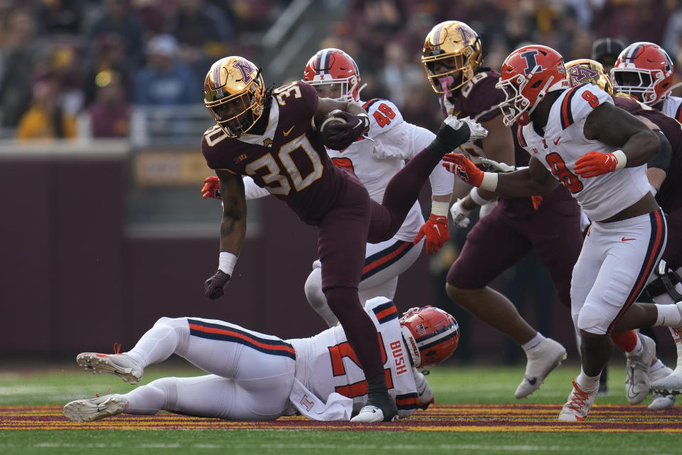 Minnesota running back Jordan Nubin (30) runs with the ball during the first half of an NCAA college football game against Illinois, Saturday, Nov. 4, 2023, in Minneapolis. (AP Photo/Abbie Parr)