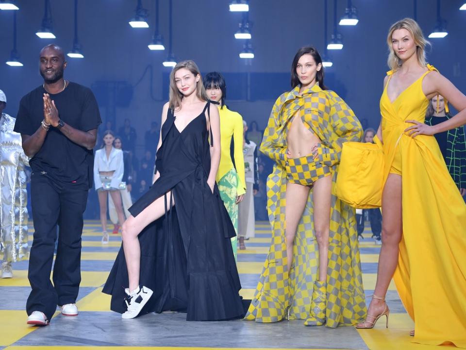 The designer with Gigi Hadid, Bella Hadid and Karlie Kloss during the finale of  the Off-White show in Paris in 2019 (Getty)
