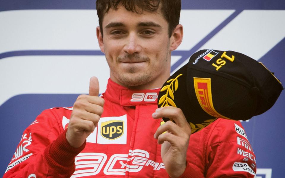 Winner Ferrari's Monegasque driver Charles Leclerc celebrates on the podium after the Belgian Formula One Grand Prix at the Spa-Francorchamps circuit in Spa on September 1, 2019. - AFP