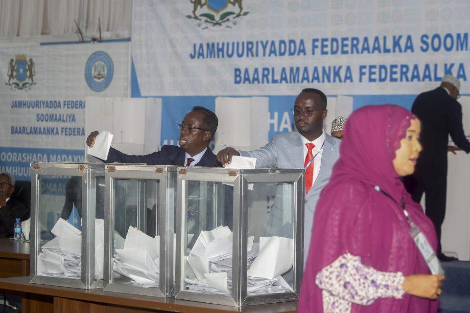 Somali lawmakers cast their votes in the presidential election, at the Halane military camp which is protected by African Union peacekeepers, in Mogadishu, Somalia Sunday, May 15, 2022. Legislators in Somalia are meeting Sunday to elect the country's president in the capital, Mogadishu, which is under lockdown measures aimed at preventing deadly militant attacks. (AP Photo/Farah Abdi Warsameh)