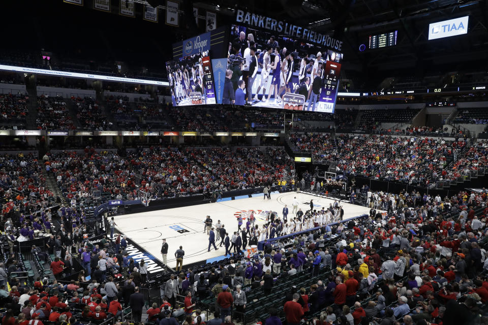 Players from Minnesota and Northwestern shake hands after an NCAA college basketball game at the Big Ten Conference tournament, Wednesday, March 11, 2020, in Indianapolis. Minnesota won 74-57. (AP Photo/Darron Cummings)