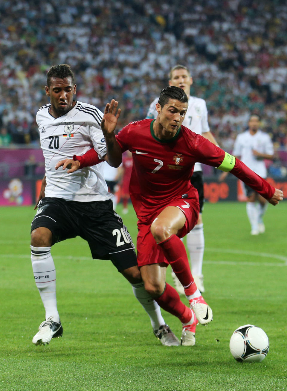 L'VIV, UKRAINE - JUNE 09: Cristiano Ronaldo of Portugal battles for the ball with Jerome Boateng of Germany during the UEFA EURO 2012 group B match between Germany and Portugal at Arena Lviv on June 9, 2012 in L'viv, Ukraine. (Photo by Joern Pollex/Getty Images)