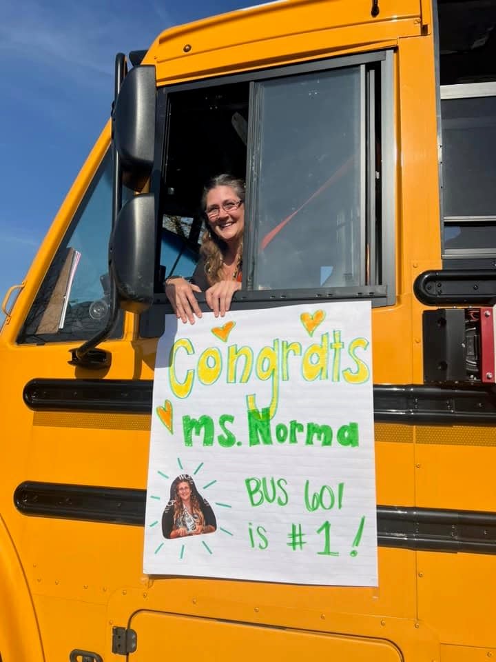 Washington County Public Schools' ESP of the Year, school bus driver Norma Kelley, aka Ms. Norma, with a sign congratulating her on the honor.