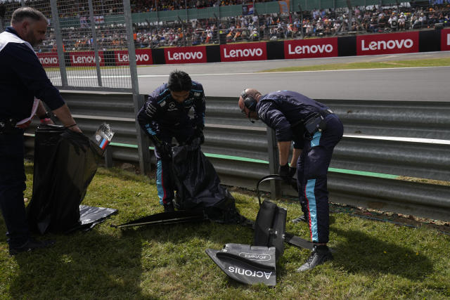 Debris from broken cars is collected during the British Formula One Grand Prix at the Silverstone circuit, in Silverstone, England, Sunday, July 3, 2022. (AP Photo/Matt Dunham, Pool)