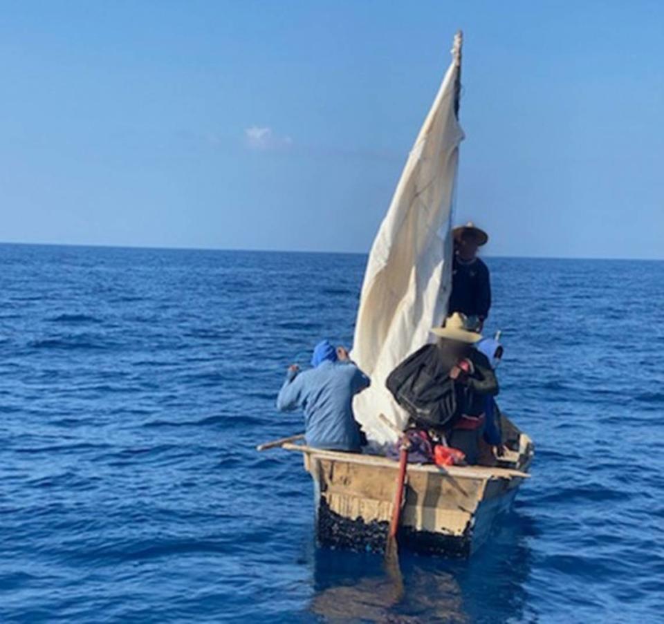 Eight Cuban migrants are on a rustic vessel on Feb. 8, 2020, off the Florida Keys. A Coast Guard Station Islamorada crew stopped the eight and they were sent back to Cuba.